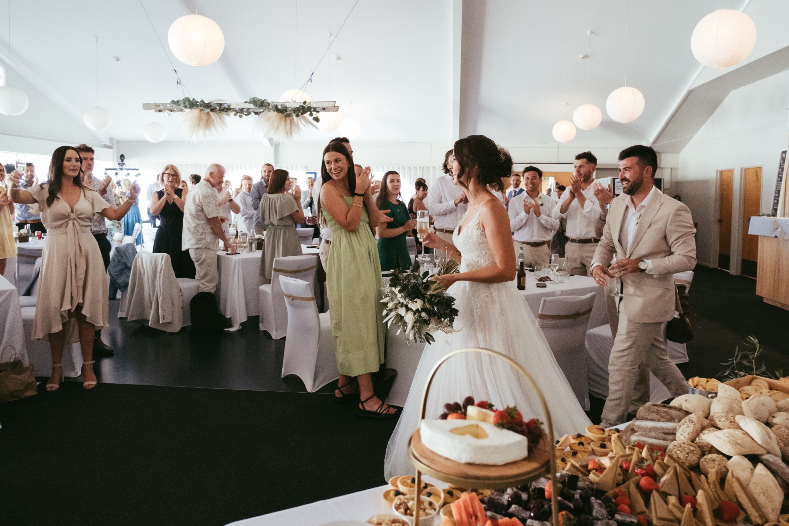 Wedding venue in action - guests enjoying the arrival of the happy couple